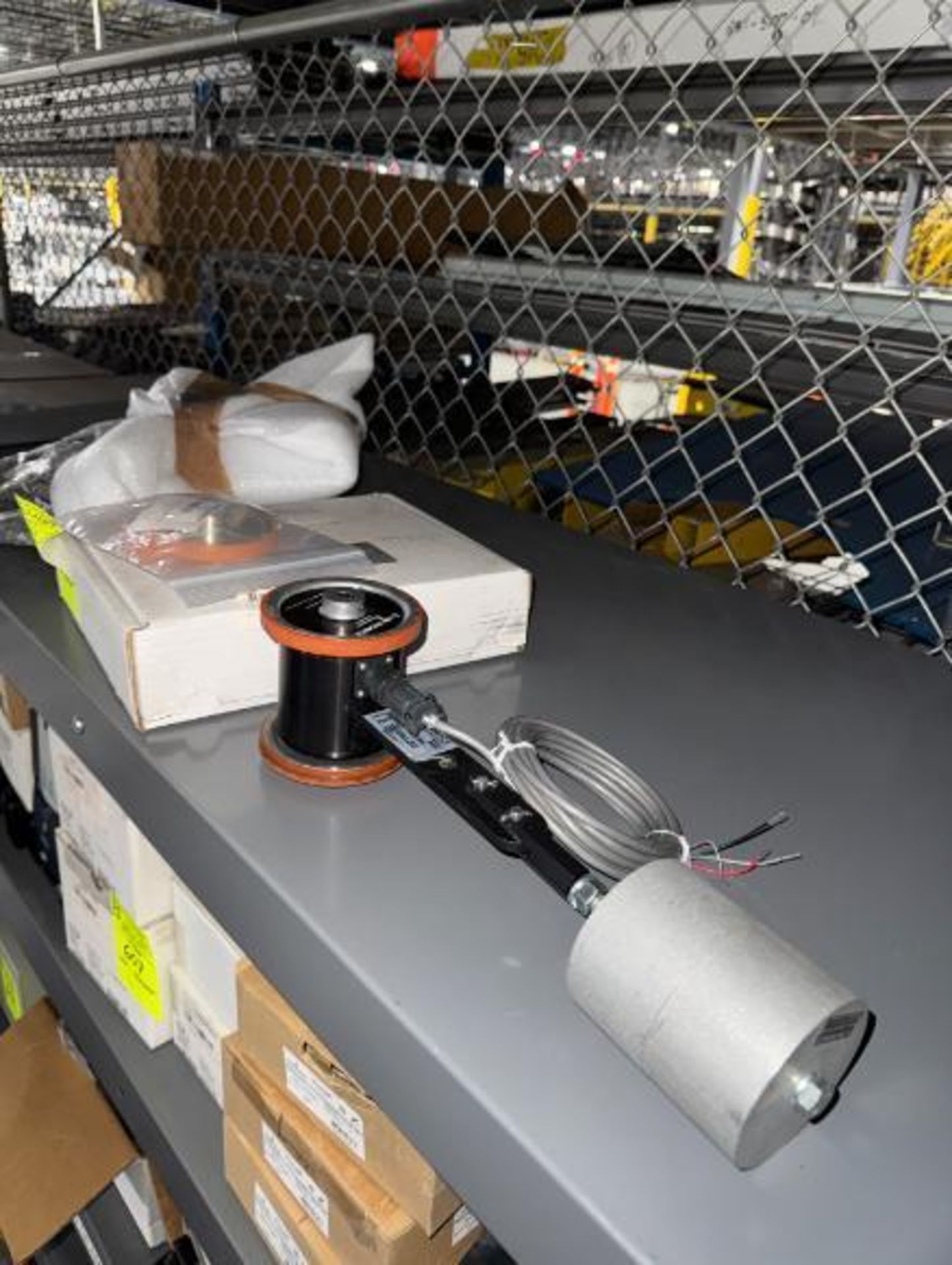 contents of top shelf- Automotion pulley, Photocraft encoder, etc