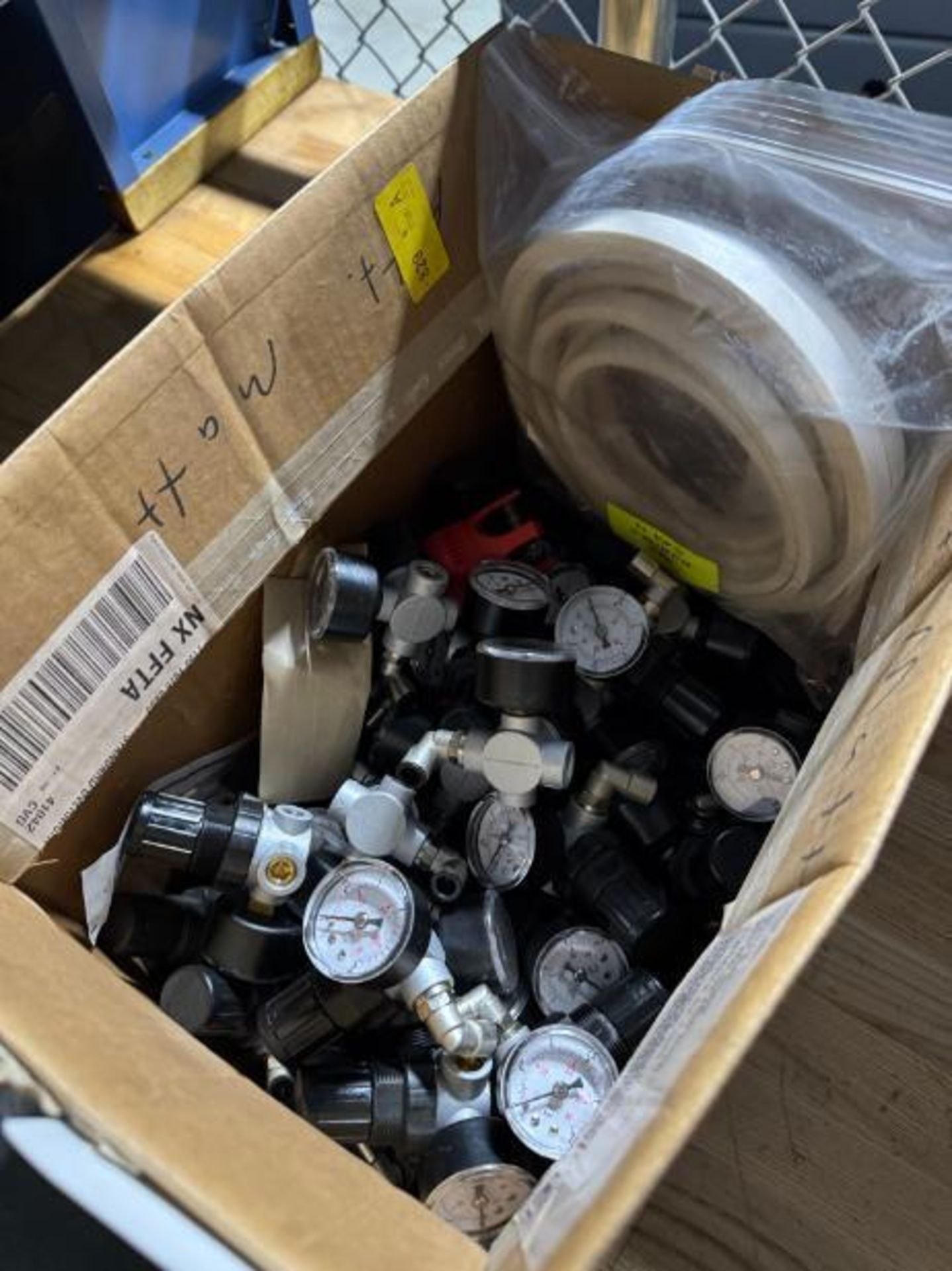 box of pneumatic valves w/ psi dials