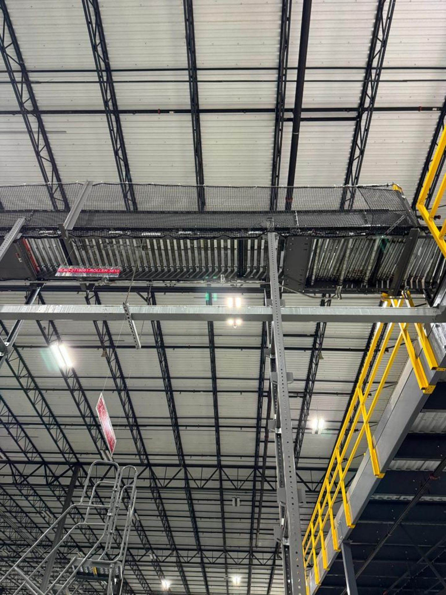 Invata partially powered roller conveyor, on ~16' uprights