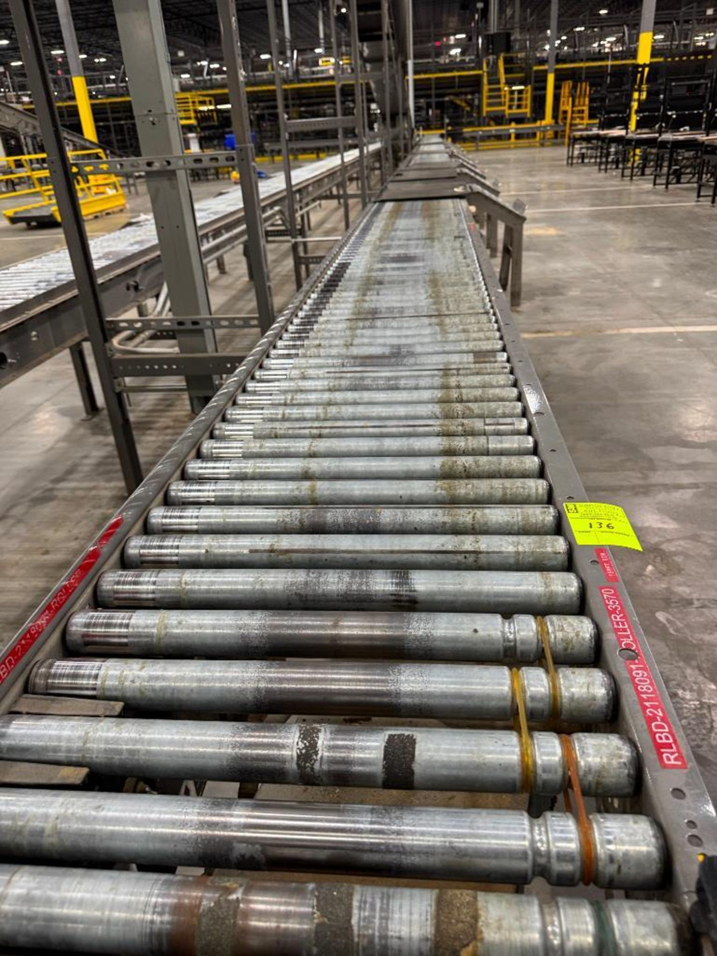 Invata partially powered roller conveyor w/ pack stations