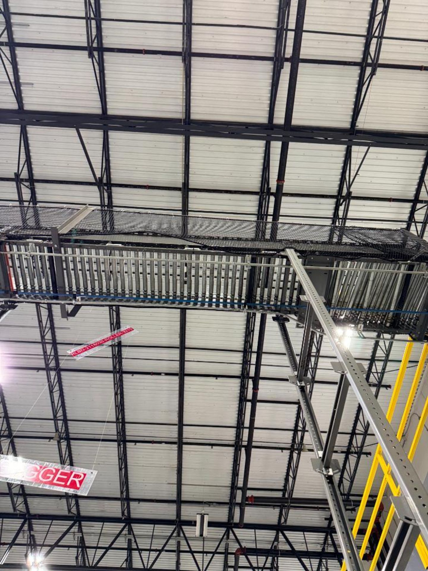 Invata partially powered roller conveyor, on ~16' uprights