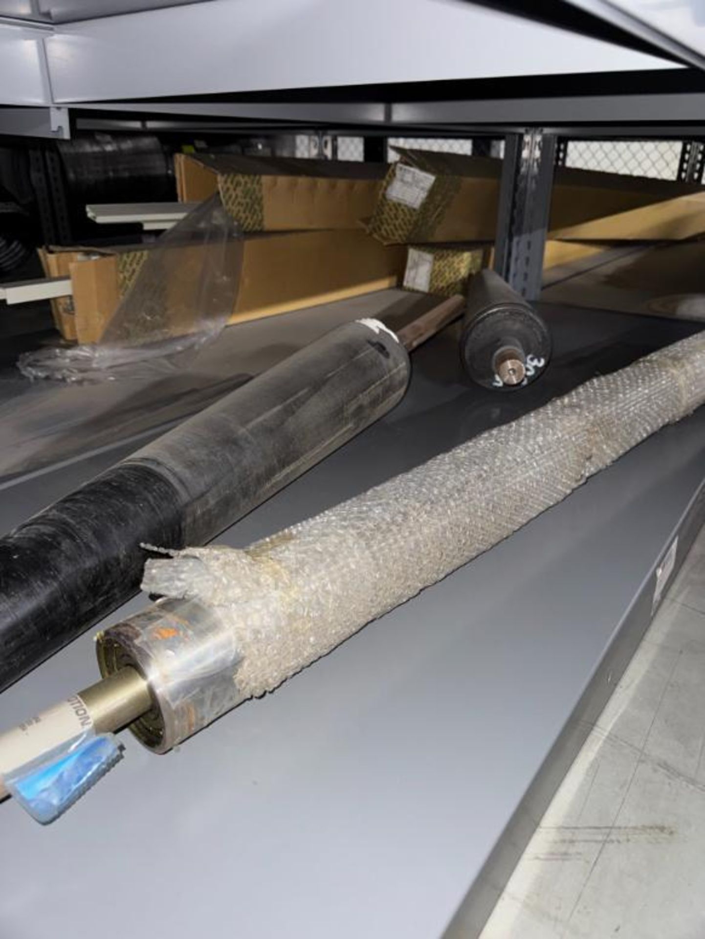 contents of 2) shelves- assorted large rollers