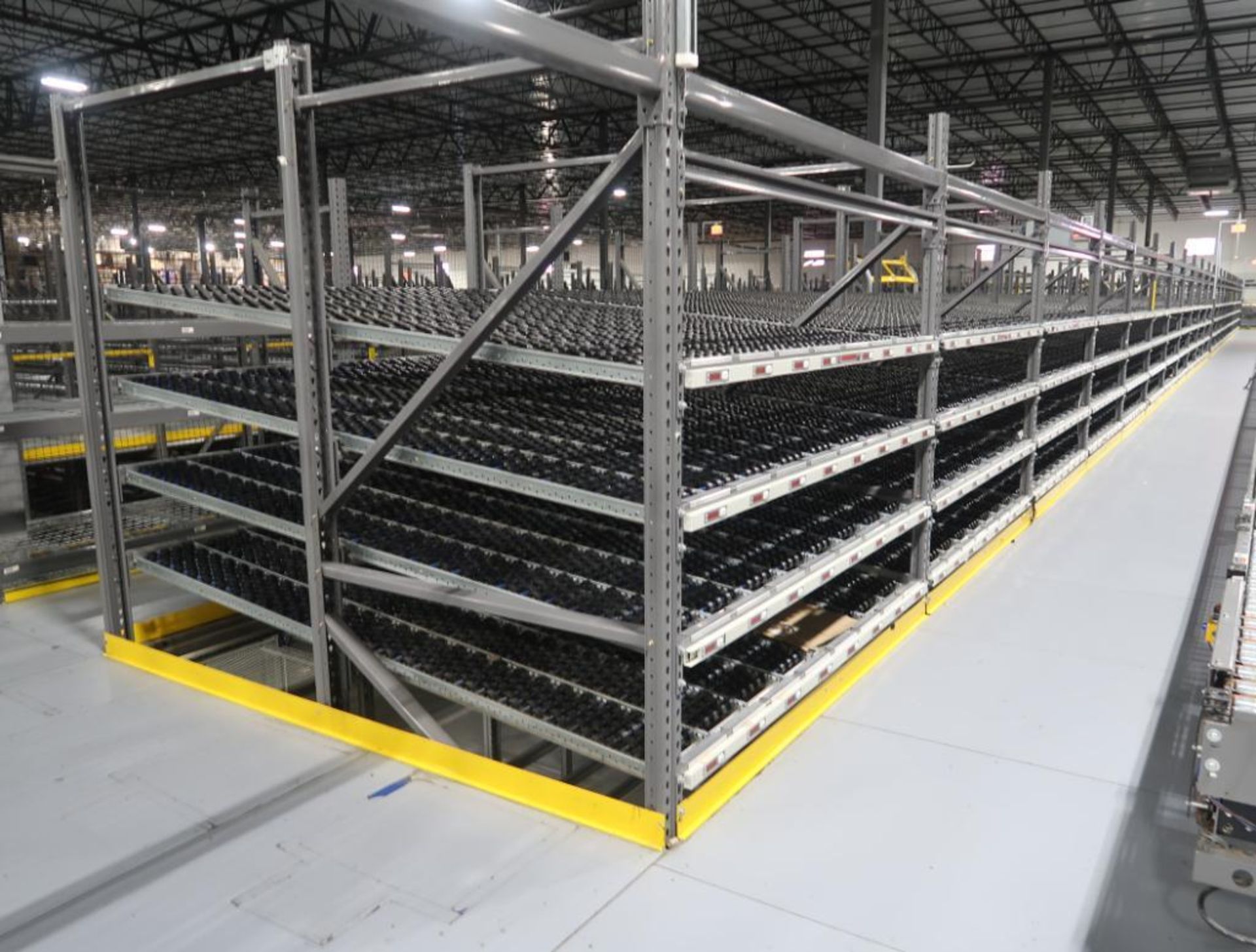 11) sections of pallet racking w/ gravity flow rollers