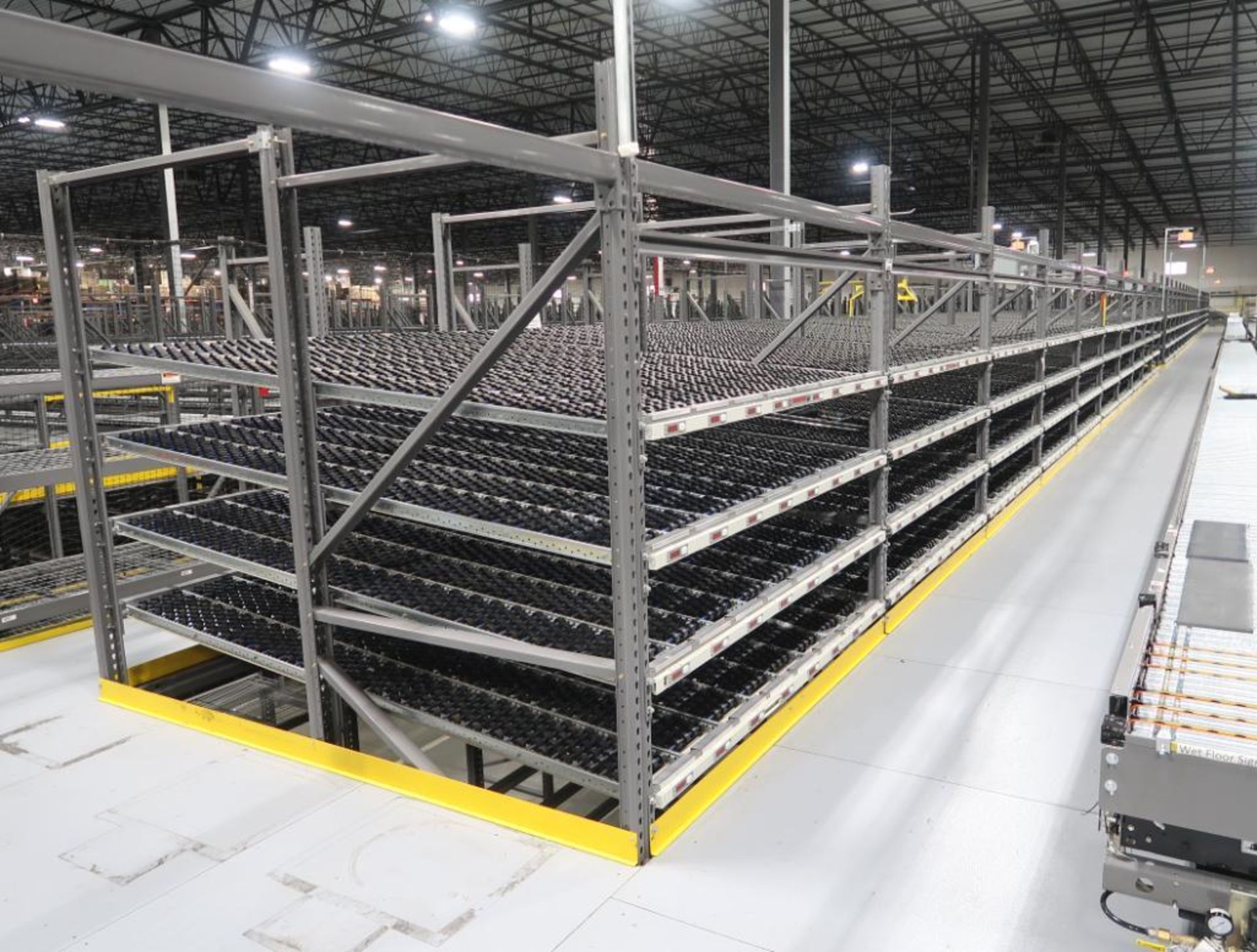 10) sections of pallet racking w/ gravity flow rollers