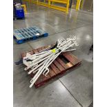 pallet of plastic rake grabbers