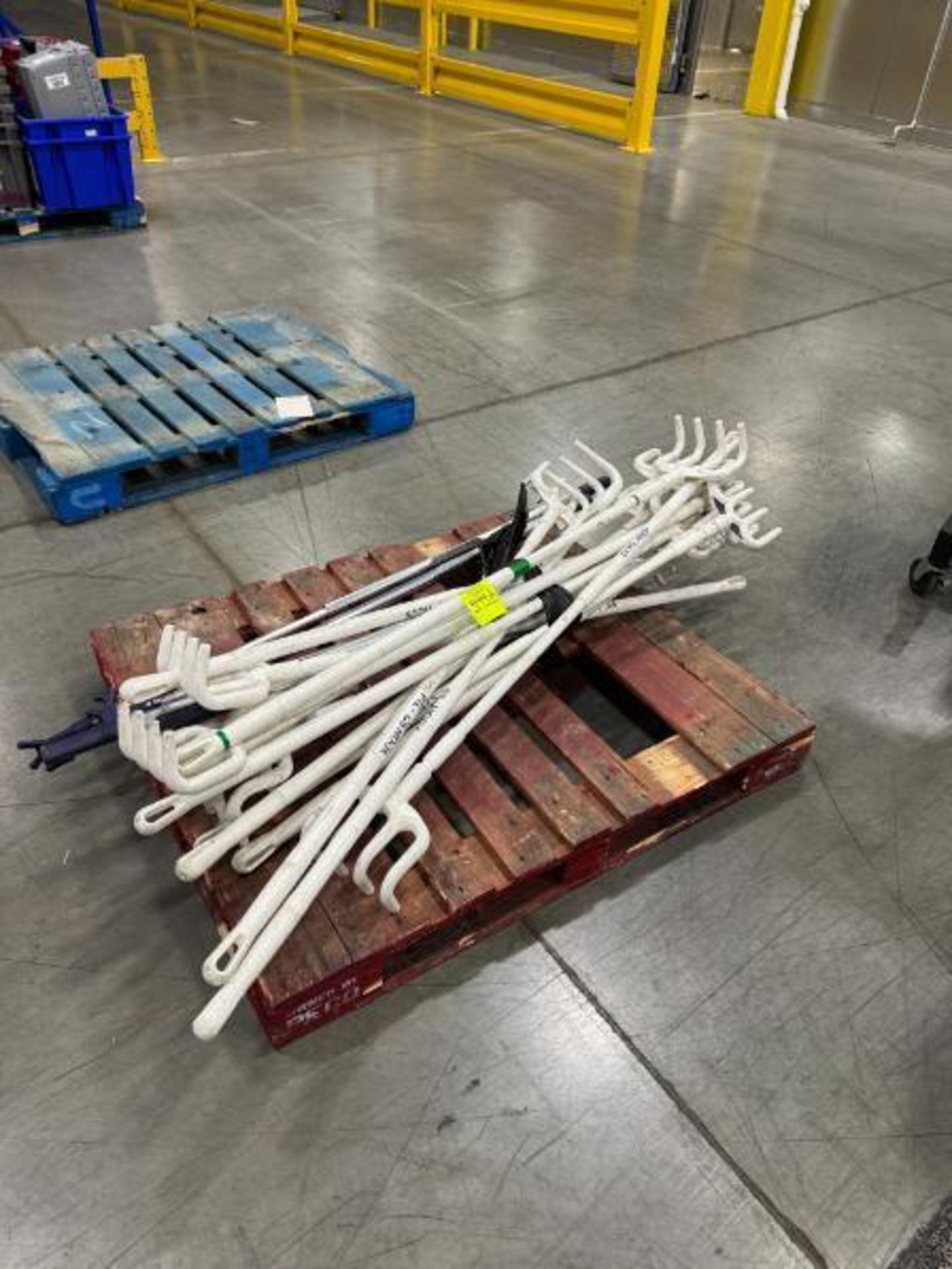 pallet of plastic rake grabbers