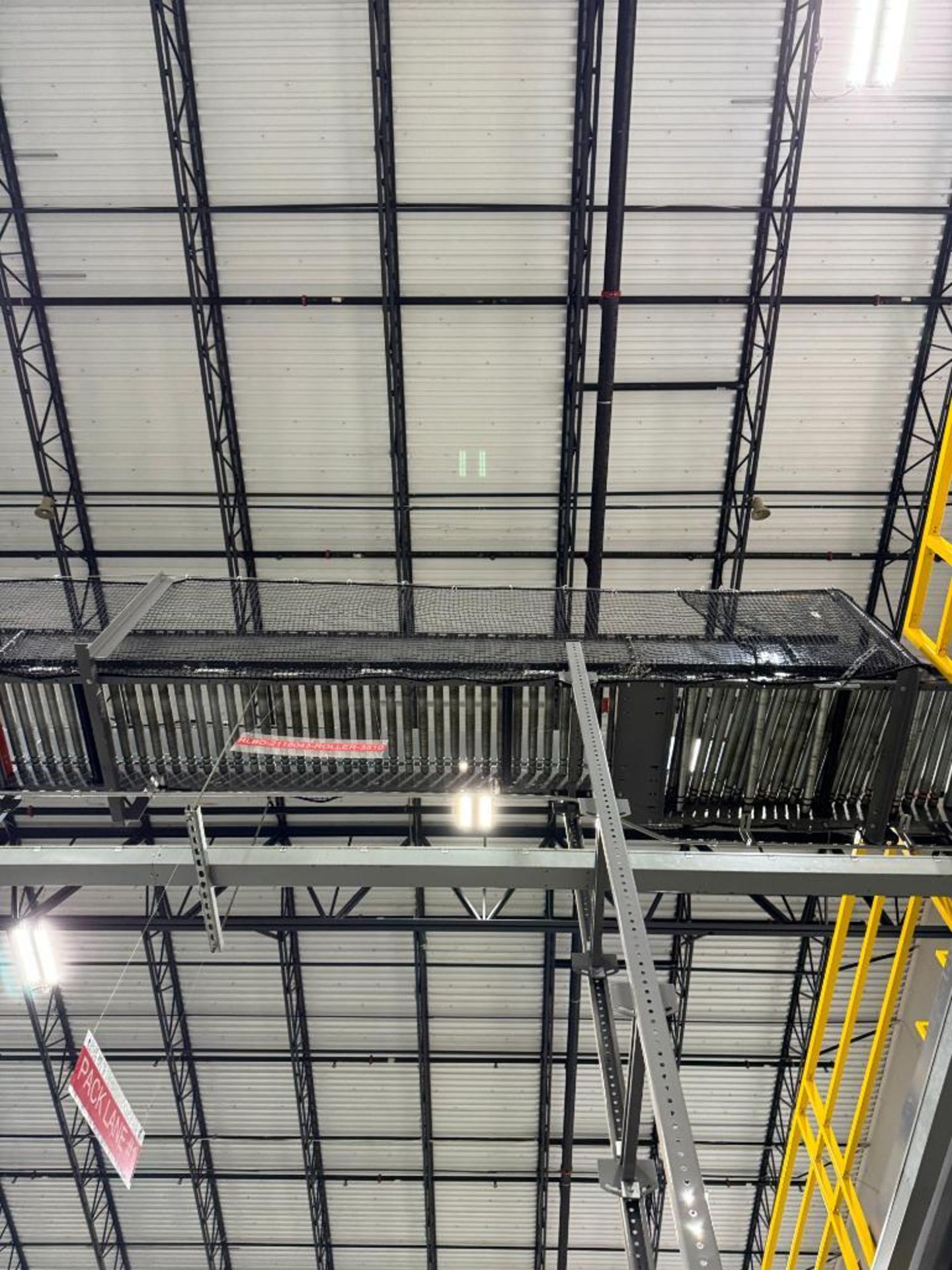Invata partially powered roller conveyor, on ~16' uprights