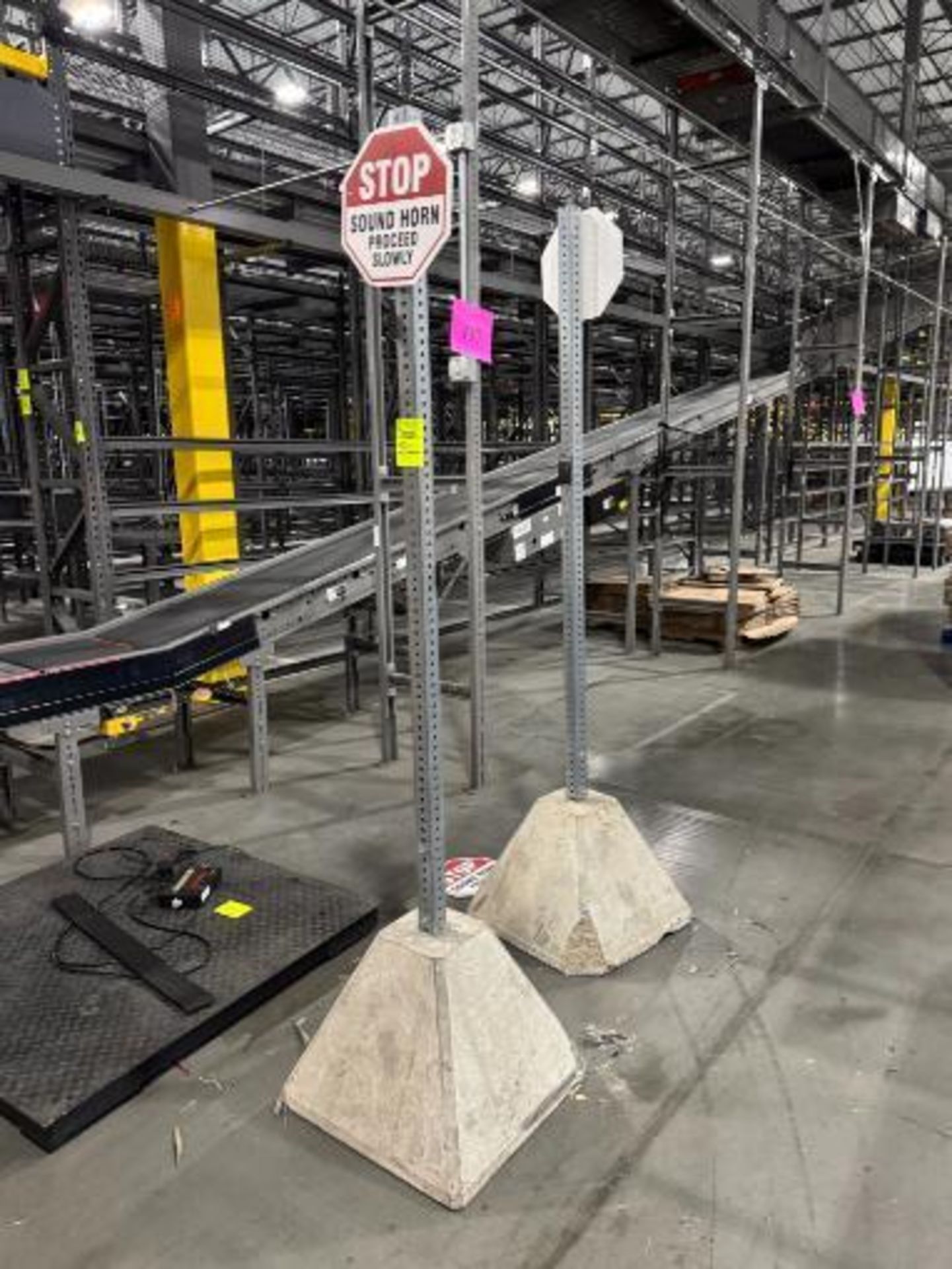 sign stanchions w/ concrete bases