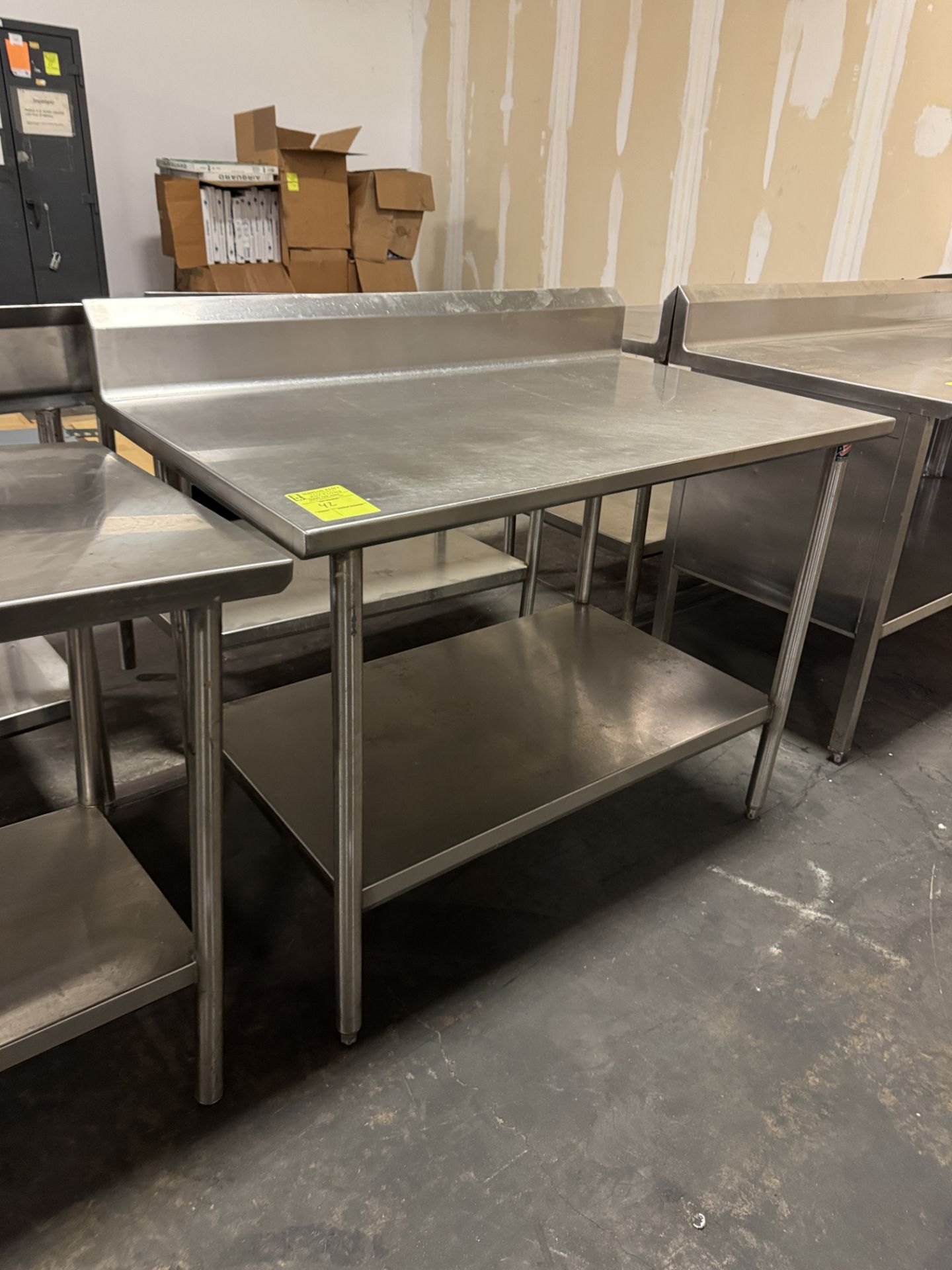 Stainless Steel table w/ undershelf & backsplash