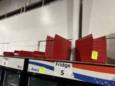 GROUP OF PLASTIC ORGANIZING BINS ON COOLERS