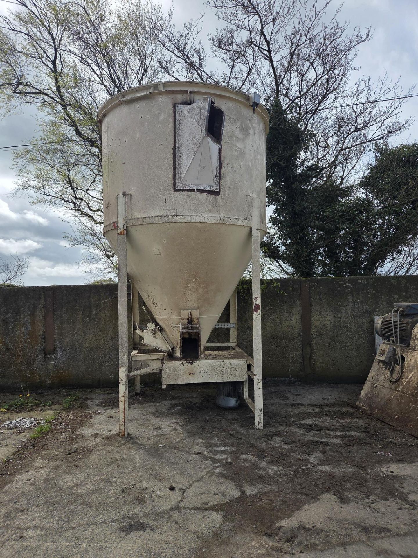 Live Bin, approx. 2.2m dia. x 3.2m high, with 11kW bottom mounted drive, it has two outlets, working