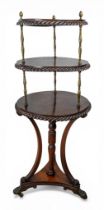 A regency mahogany and brass three-tier dumb waiter, early 19th century