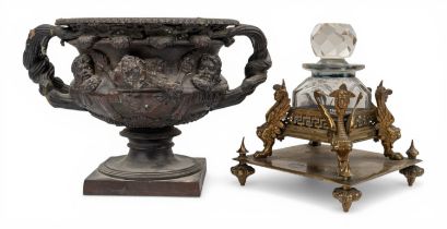 A small bronze antique depiction of a Warwick vase and a neo-classical inkwell