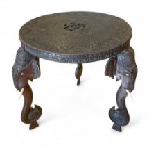 Antique, A profusely carved table with elephant legs
