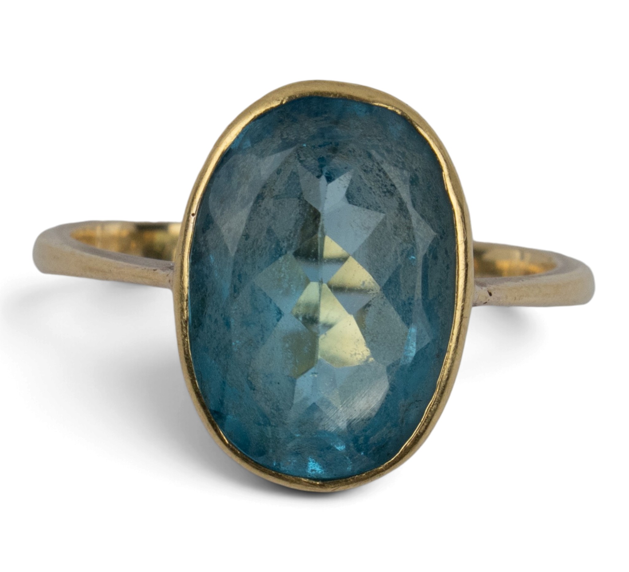 Real Blue Topaz Rings A 18ct gold and blue topaz oval single-stone ring, circa 1970 The oval ...