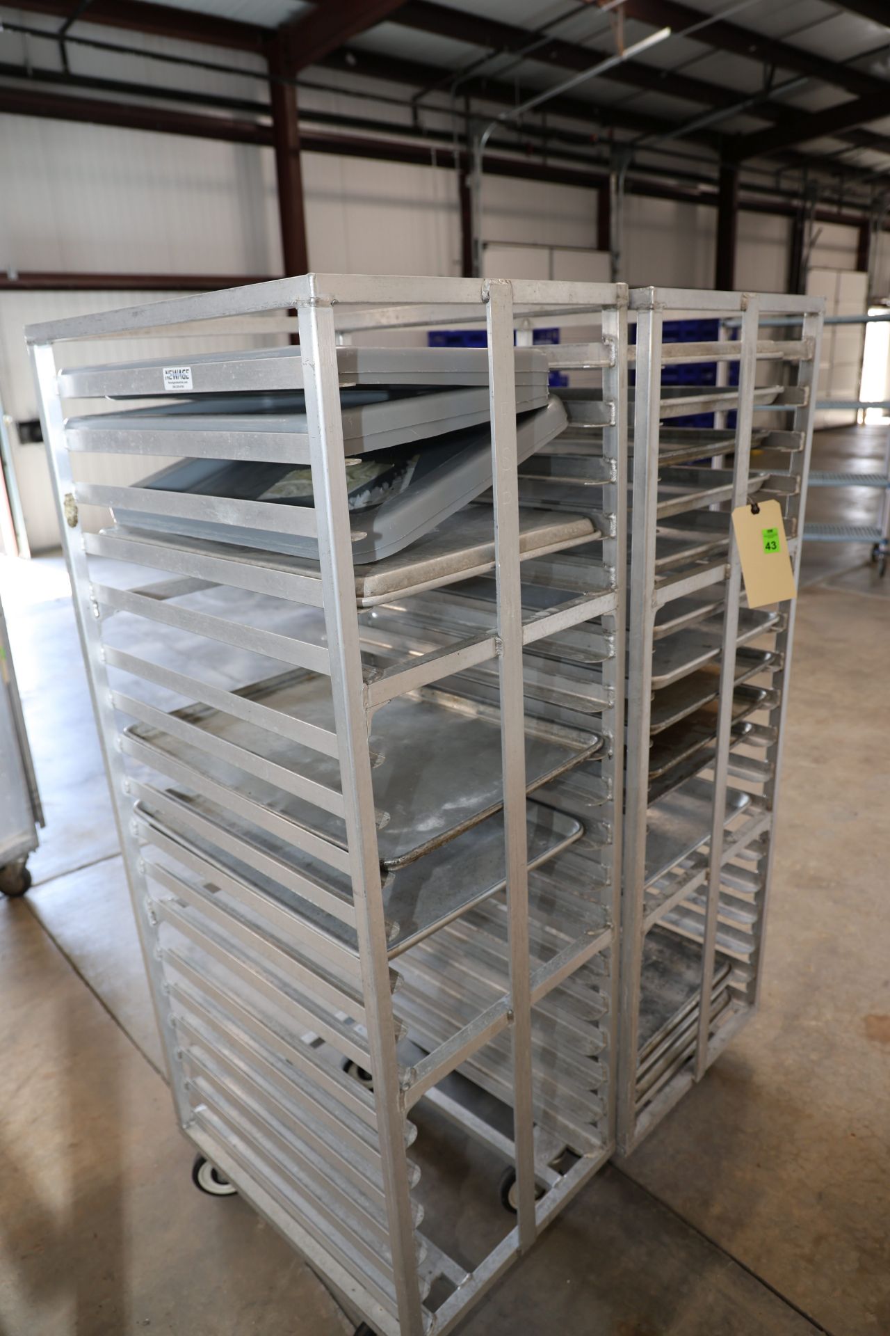 Two speed racks by Newage Industrial, height 63½”, width 20½”, depth 26