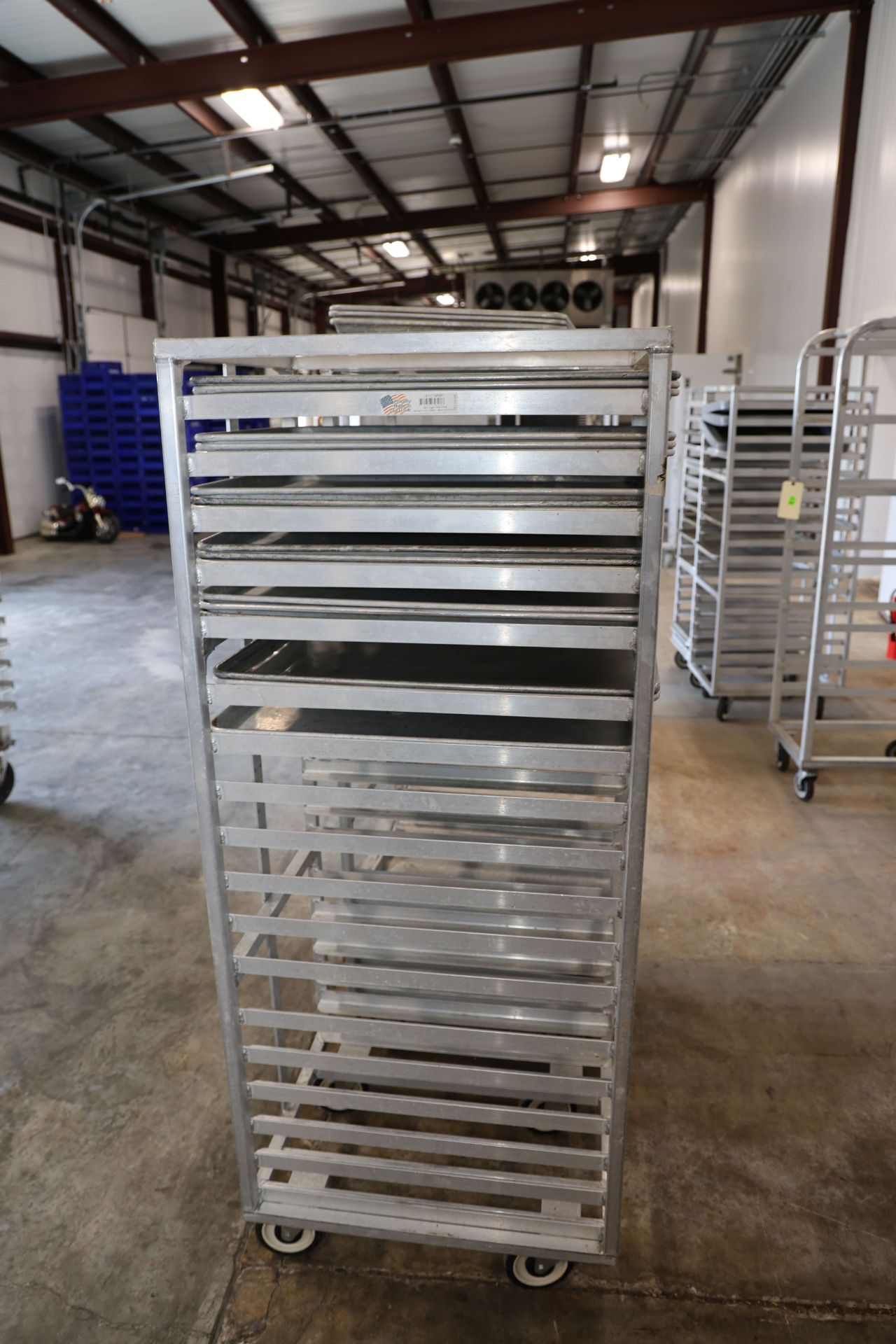 Speed Rack Interchangaable Two speed racks by Newage Industrial, height 63½”, width 20½”, depth 26
