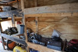 Contents of shelf including gaskets, brackets, and fire extinguishers