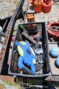 Tools including measuring tape, staples, battery charger, mallet, and Everbilt 211 utility pump