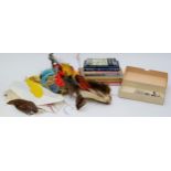 A collection of hand tying fly fishing equipment to include a brass bench tying vice, grips, wax,