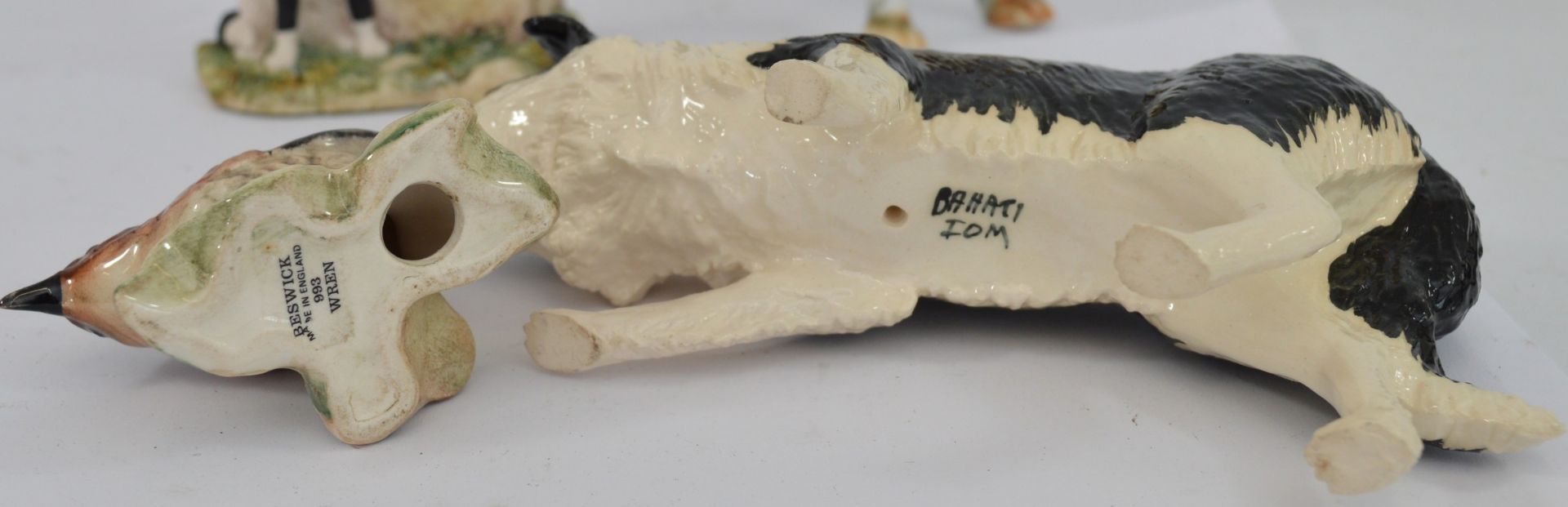 A group of six porcelain animal figurines, including a Beswick Robin, perched on a branch with holly - Image 2 of 3