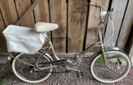 A Hercules Folda ladies folding bicycle with rear shopping basket.