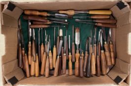 A collection of mid twentieth century and later wood turning and wood carving chisels to include
