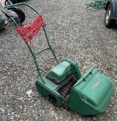 An Atco Qualcast Classic L80591 240v lawnmower with collection tray.
