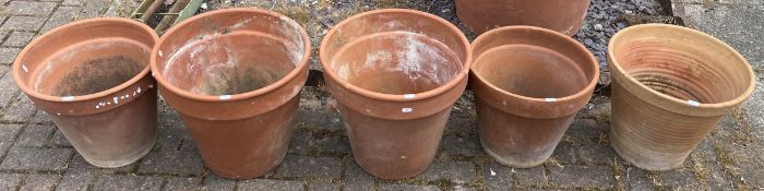 A collection of five terracotta garden planters, largest 40.5 diameter x 39cm high, smallest 36cm