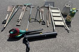 A collection of gardening tools to include forks and spades. Together with a step ladder and a