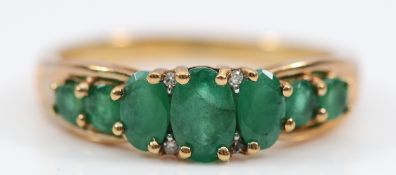A 9ct gold emerald and single cut diamond dress ring, P, 2.8g