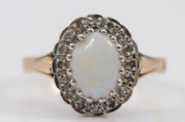 A 9ct gold opal and single cut diamond cluster ring, P 1/2, chip to the opal, 3.9g