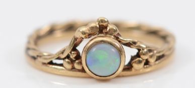 A 9ct gold opal twisted band ring, K 1/2, 1.8g