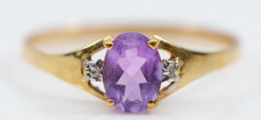 An unmarked 9ct gold amethyst and diamond three stone ring, Q, 1g