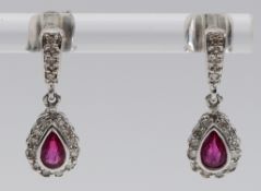 A pair of 9ct white gold single cut diamond and pink sapphire earrings with scroll backs, 17mm, 2g