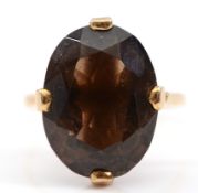 A 9ct gold smokey quartz cocktail ring, 18mm x 14mm smokey quartz, London 1989, P 1/2, 5.3g