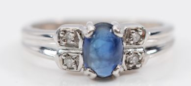 A 9ct white gold sapphire cabochon and diamond dress ring, Birmingham 2005, N 1/2, 2.7g