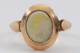 A 9ct gold opal dress ring, Birmingham 1977, chip to one edge of the opal, L, 2.8g