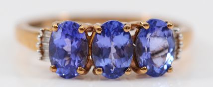A 9ct gold tanzanite and diamond dress ring, O, 2.3g