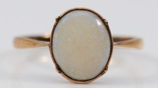 A 9ct gold opal solitaire ring, L 1/2, 1.1g