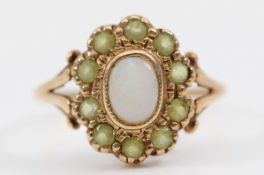 A 9ct gold opal and peridot dress ring, O, 2.5g