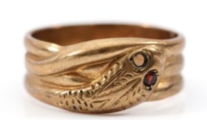 A 9ct gold snake ring with garnet eyes, one setting vacant, Birmingham 1966, U, 5.4g