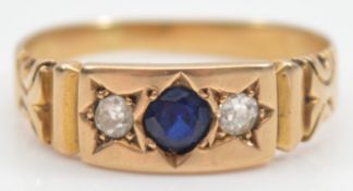 A 15ct gold sapphire and old brilliant cut diamond three stone ring, hallmarks worn, P, 3.2g