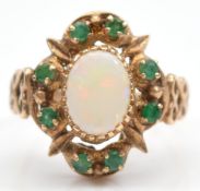 A 9ct gold opal and emerald dress ring, London 1977, hallmarks worn, P, 4.7g