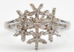A 9ct white gold vari cut diamond floral dress ring, O, 3.9g