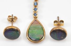 A pair of 9ct gold ammolite circular earrings, with a matching ammolite and sapphire pendant, 3.3g