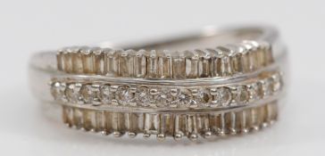 A 9ct white gold vari cut diamond three row dress ring, M, 2.6g
