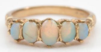 A 9ct gold opal five stone dress ring, P, crack to one opal, 3.3g