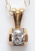 A 9ct gold brilliant cut diamond pendant on a chain, approximately 0.33ct, 1.1g
