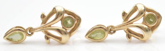 A pair of 9ct gold peridot drop earrings with scroll backs, 20mm, 2.1g